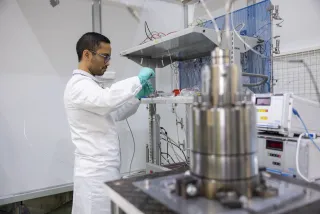 a scientist operating material development equipment
