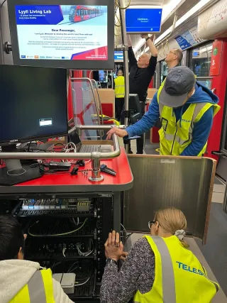 a tram with a living lab equipment rack below with a display above