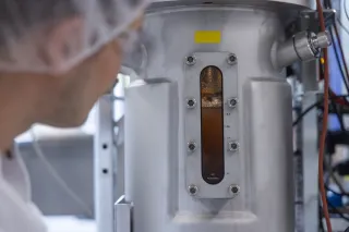 a scientist operating a fermentation bioreactor