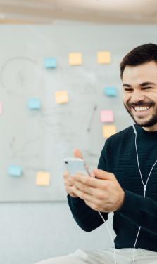 mansmilingandtalkingtosomeoneonaphone